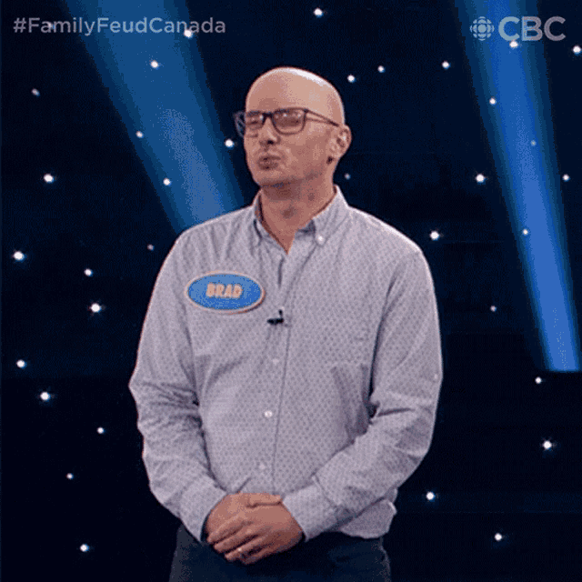 a man with a name tag that says brad on it