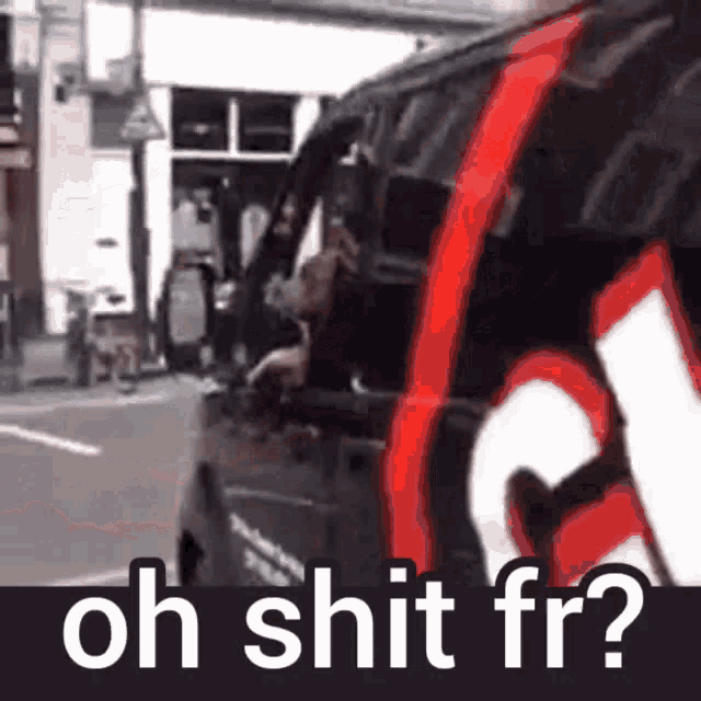 a black and red van is parked on the side of the road with the words oh shit fr written on it .