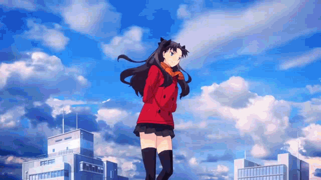 a girl in a red jacket and black skirt is standing in front of a city skyline .