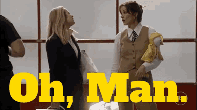 two women are standing next to each other with the words oh man written in yellow