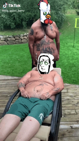 a man with a tattoo on his chest that says big is standing next to a man laying in a chair