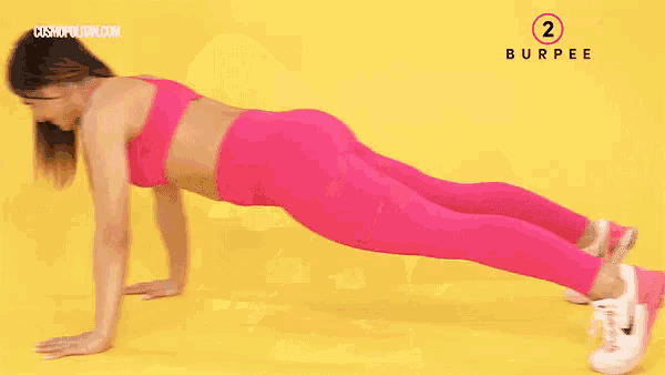 a woman in pink leggings is doing a burpee exercise on a yellow background .