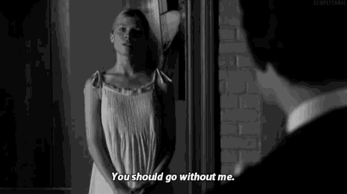 a man and a woman are standing next to each other and the woman is saying `` you should go without me . ''