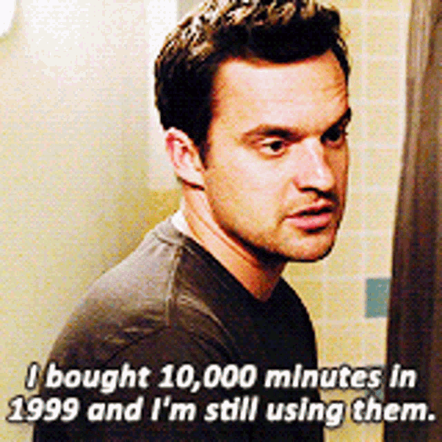 a man standing in a bathroom with a caption that says i bought 10,000 minutes in 1999