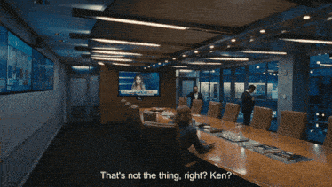 a woman sits at a conference table and says " that 's not the thing right ? ken "