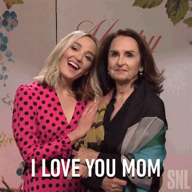 two women posing for a picture and one of them says i love you mom snl