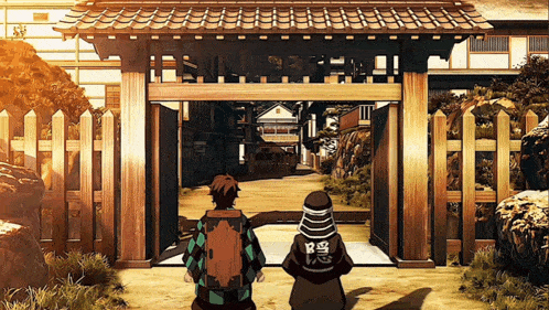 a couple of people standing in front of a building with chinese writing