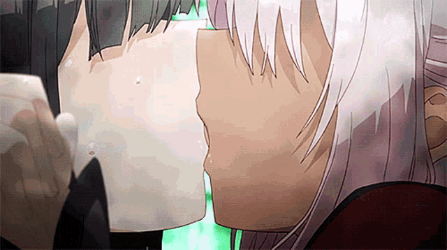 a couple of anime characters kissing each other with a green background