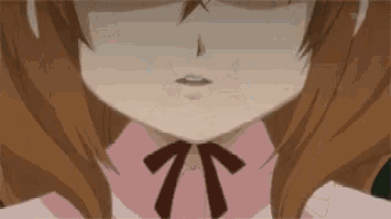 a close up of a girl 's face with glasses and a bow tie .