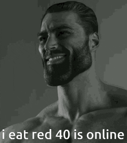 a man with a beard is smiling with the words i eat red 40 is online