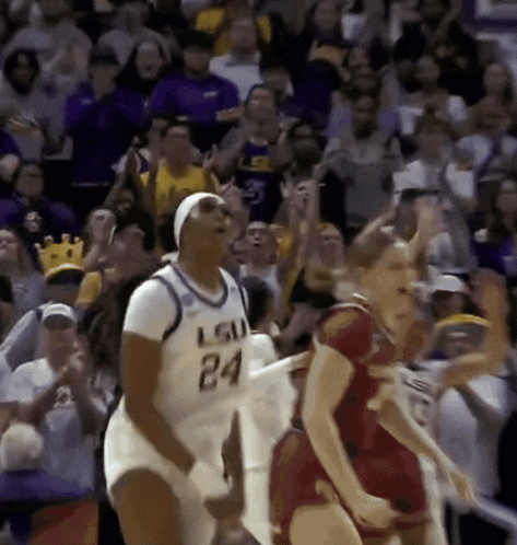 a female basketball player wearing a white jersey with the number 24 on it