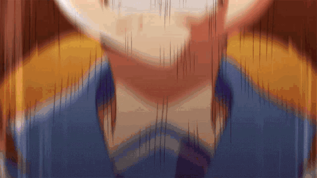 a blurry picture of a person 's face with a blue shirt and tie