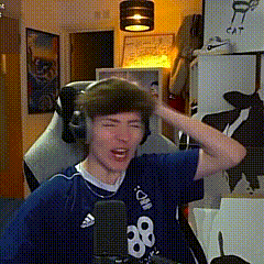 a young man wearing headphones and a blue shirt with the number 88 on it .