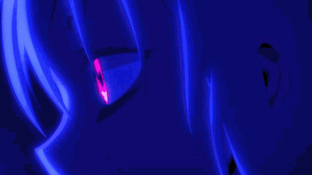 a close up of a person 's eye with a glowing red pupil