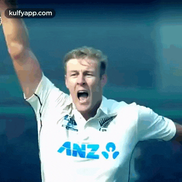 a man in a white shirt with anz on it