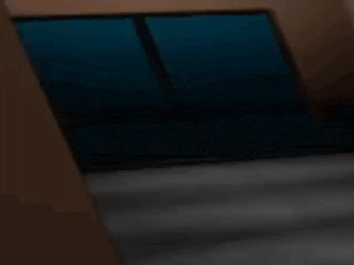 two bart simpson figures are standing next to each other in a dark room