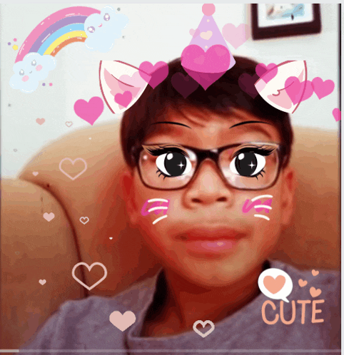a boy wearing glasses and a cat ear headband with the word cute on the bottom left