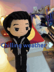 a crocheted doll with the words chilling weather written on it