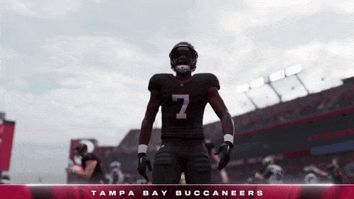 tampa bay buccaneers player number 7 stands in front of a stadium