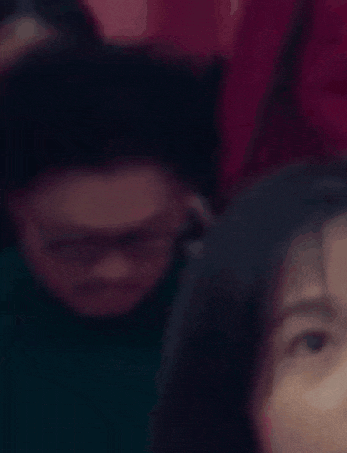 a yellow hand is visible in front of a woman