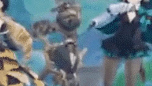 a blurry picture of a group of people standing next to each other in a field .