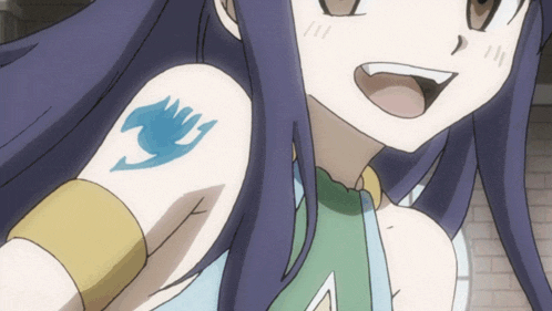a close up of a girl with a tattoo of fairy tail on her arm