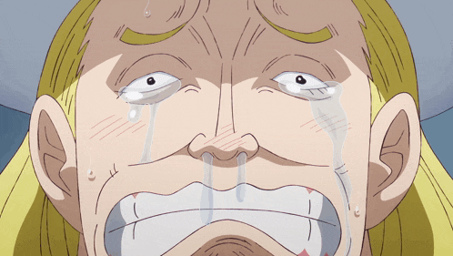 a close up of a man 's face with tears running down his face