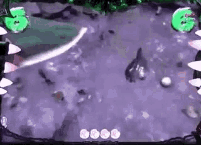a video game is being played on a computer screen with a shark eating a ball .
