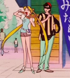 a man and a woman are standing next to each other and the man is wearing a striped shirt