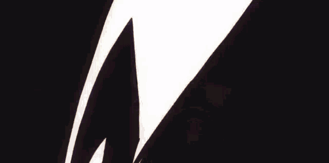 a cartoon character is flying through the air with a light coming out of his hands .