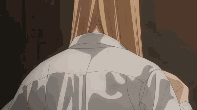 a close up of a person 's back with a shirt that says " a " on it