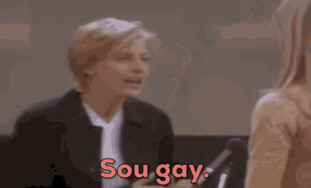 two women are sitting next to each other and one of them is talking to the other .