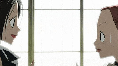 two anime girls are standing next to each other in front of a window and talking to each other .