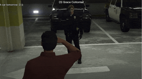 a man salutes a police officer named grace cottontail in a parking garage