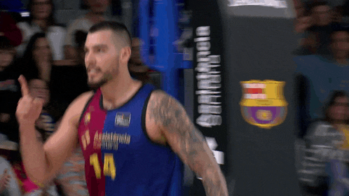 a basketball player wearing a jersey that says 14 on it