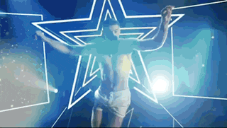a shirtless man is standing in front of a blue star