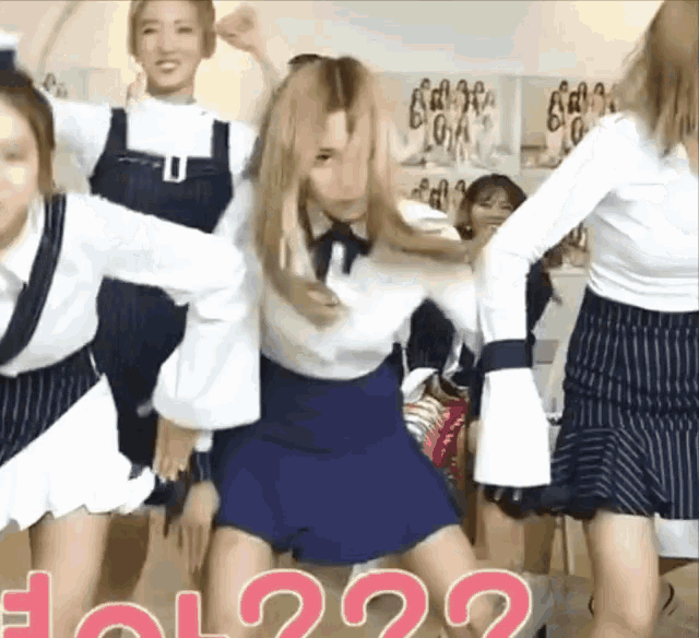 a group of young women are dancing in front of a sign that says lol ?