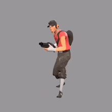 a man in a red shirt is jumping in the air while holding a gun .