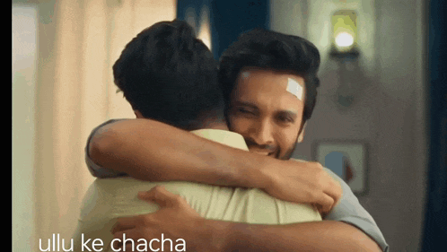 a man hugging another man with the words ullu ke chacha below them