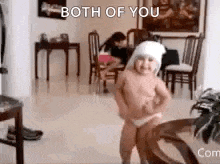 a little girl is dancing in a living room with the words `` both of you '' written above her .