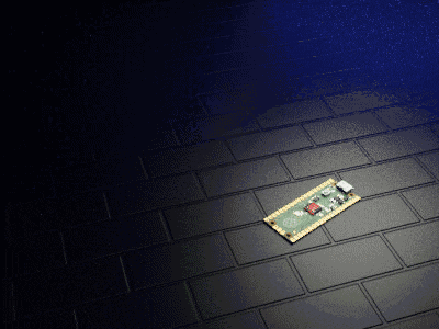 a small electronic device is laying on a black brick floor