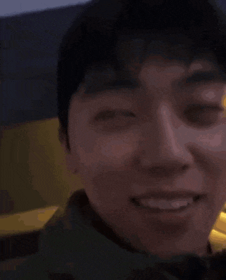 a close up of a man 's face with his eyes closed