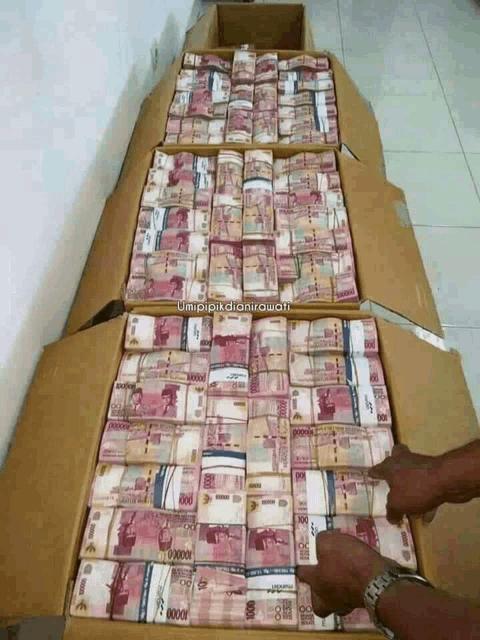 a box filled with stacks of money with the caption umipikdianiawati