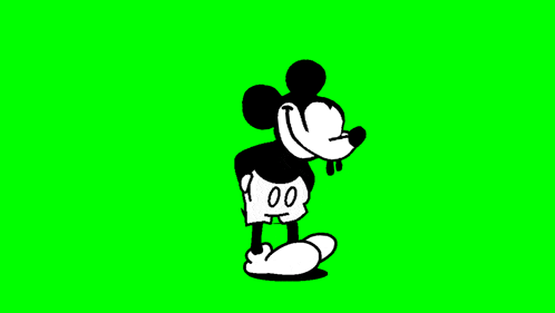 mickey mouse is walking on a green screen in a cartoon .