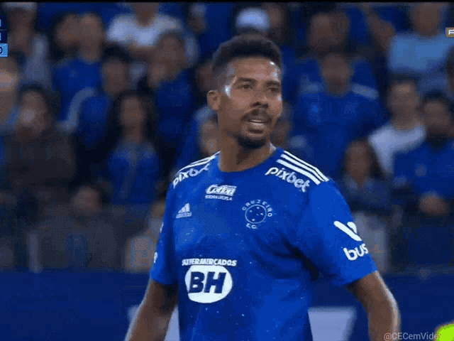 a man wearing a blue jersey with bh on the sleeve