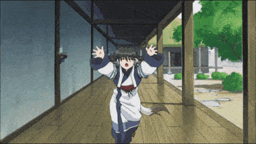 a girl in a kimono is running down a hallway