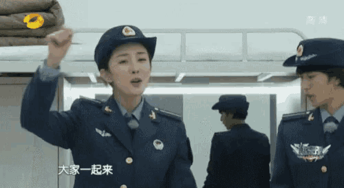 a man and a woman in military uniforms with chinese writing on them