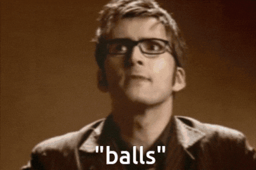 a man wearing glasses says " balls " while looking up