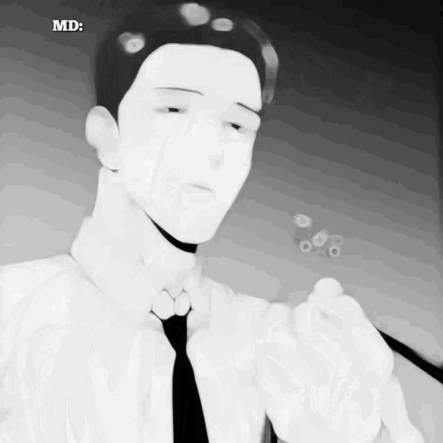 a black and white photo of a man with the word md on the bottom right