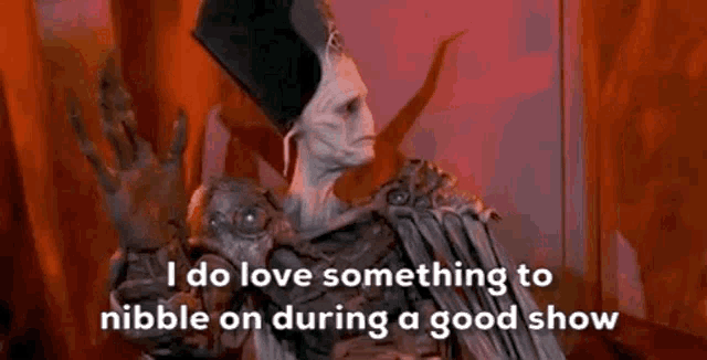 a cartoon character is saying `` i do love something to nibble on during a good show ''